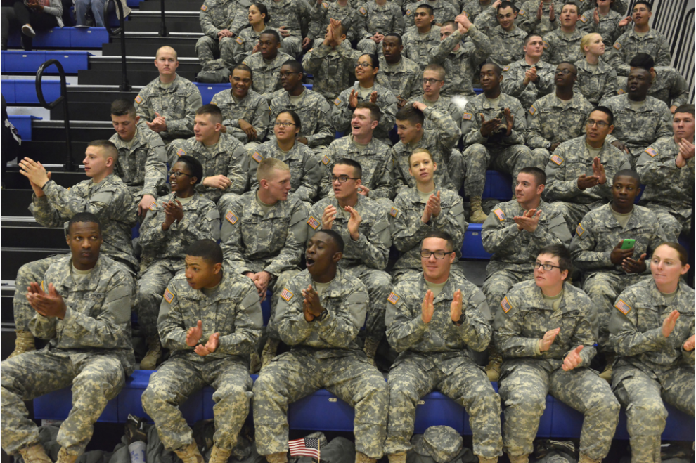 military sitting in audience