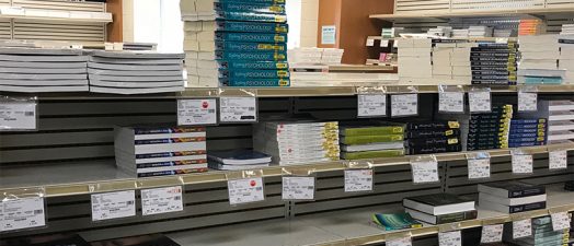 shelves lined with college textbooks