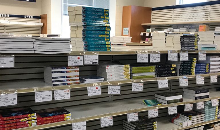 shelves lined with college textbooks