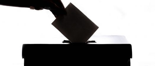 A person casting their vote.