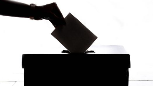 A person casting their vote.