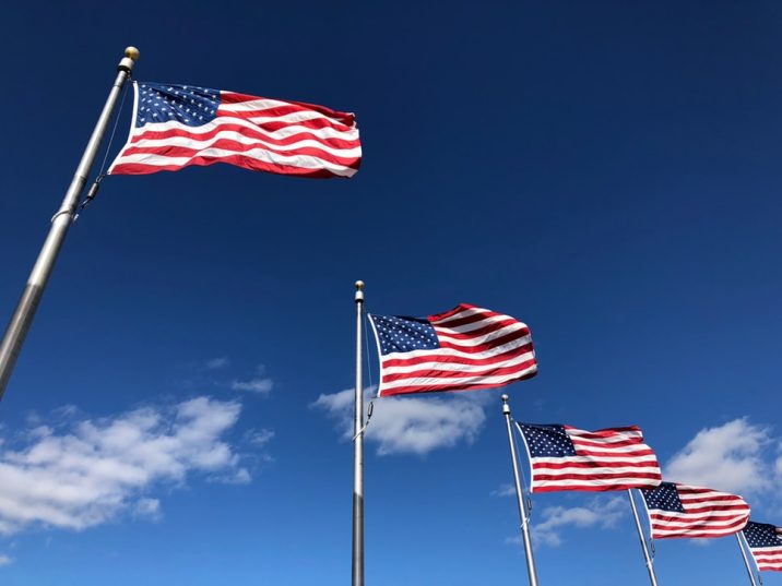 American flags waving in the sky.