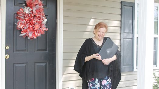 Woman holding a computer