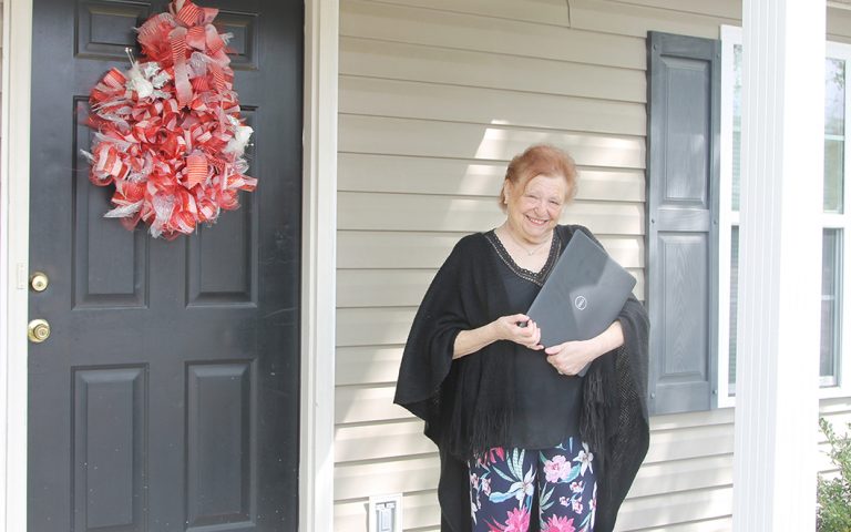 Woman holding a computer