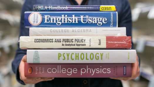 stack of 6 college textbooks, including psychology, physics and algebra