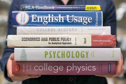 stack of 6 college textbooks, including psychology, physics and algebra