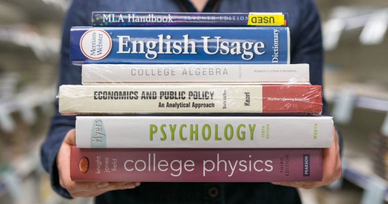stack of 6 college textbooks, including psychology, physics and algebra