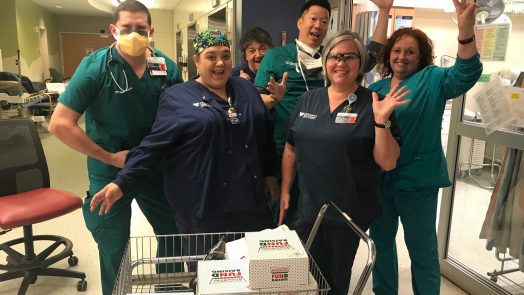Health care workers with doughnuts