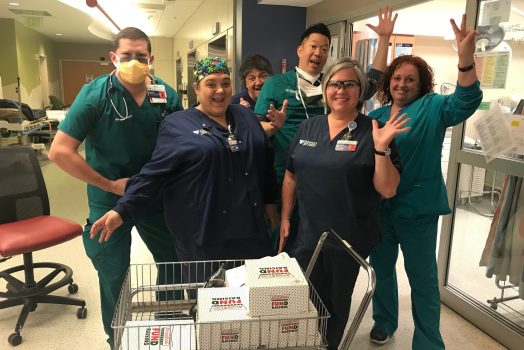 Health care workers with doughnuts