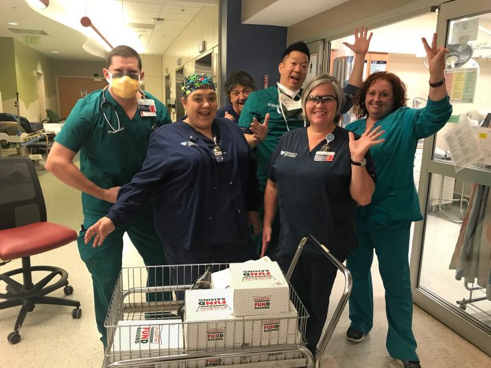 Health care workers with doughnuts