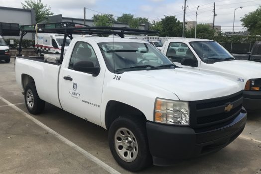 White work truck with Augusta University logo on passenger door