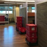 Red Moving Bins in office