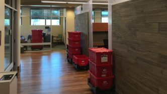 Red Moving Bins in office