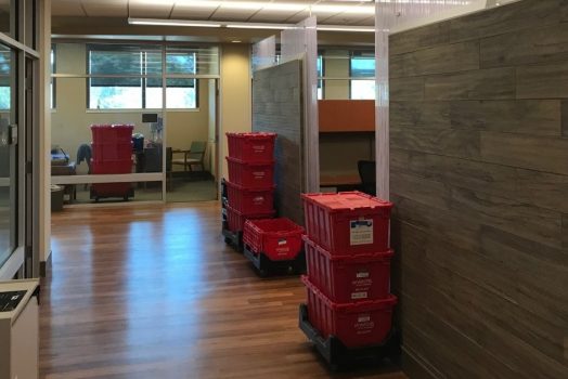 Red Moving Bins in office