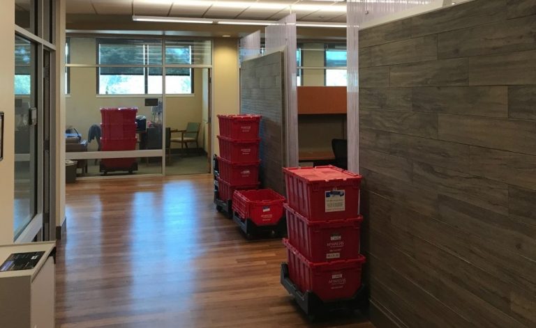 Red Moving Bins in office