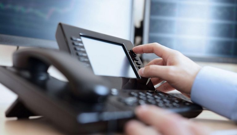 telephone with man hand on buttons