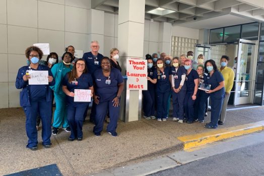 nurses holding signs