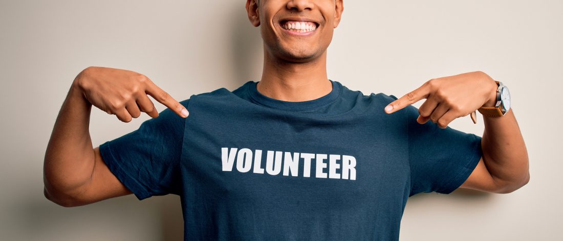 Man in volunteer shirt