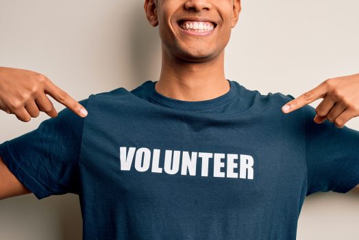 Man in volunteer shirt