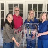 People holding a box