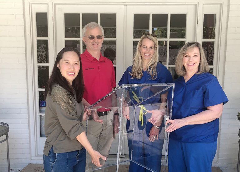 People holding a box