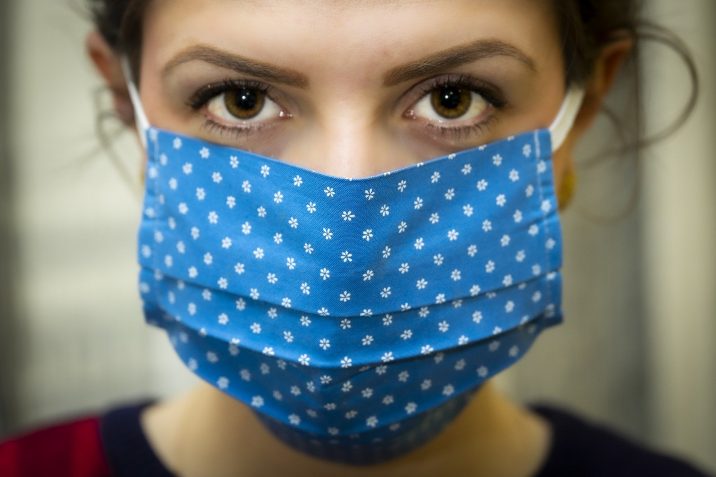 Woman with a blue face mask.