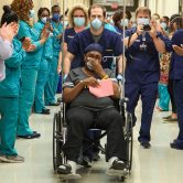 Woman in wheelchair in hallway