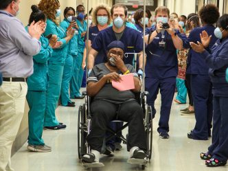 Woman in wheelchair in hallway