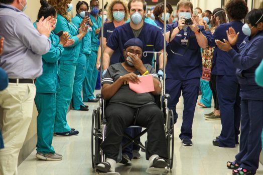 Woman in wheelchair in hallway