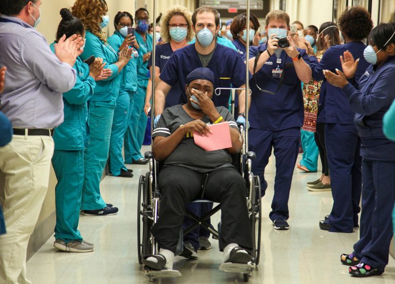 Woman in wheelchair in hallway