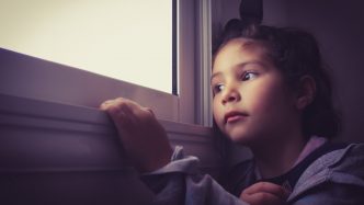 Girl looking out of the window