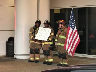 Firefighters with flag