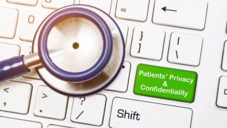 stethescope on keyboard with patient privacy button