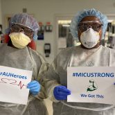 nurses holding signs