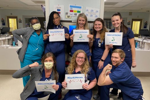 nurses holding signs