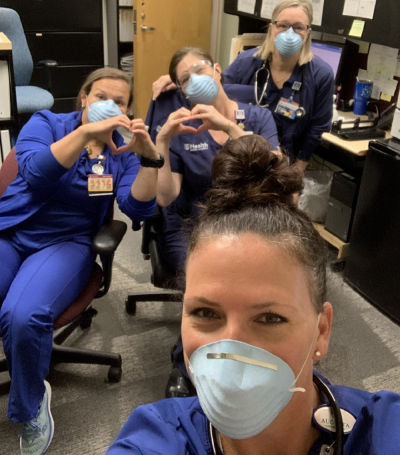 four nurses wearing masks