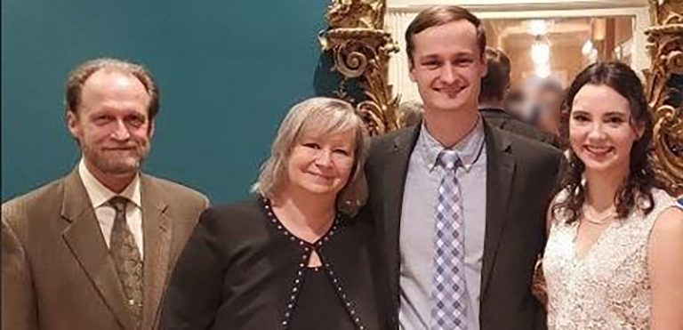 Four people standing