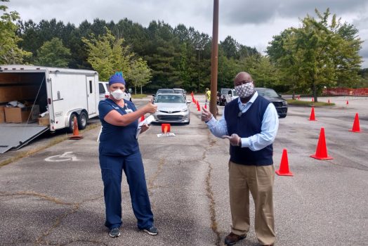 man and woman pointing to car line