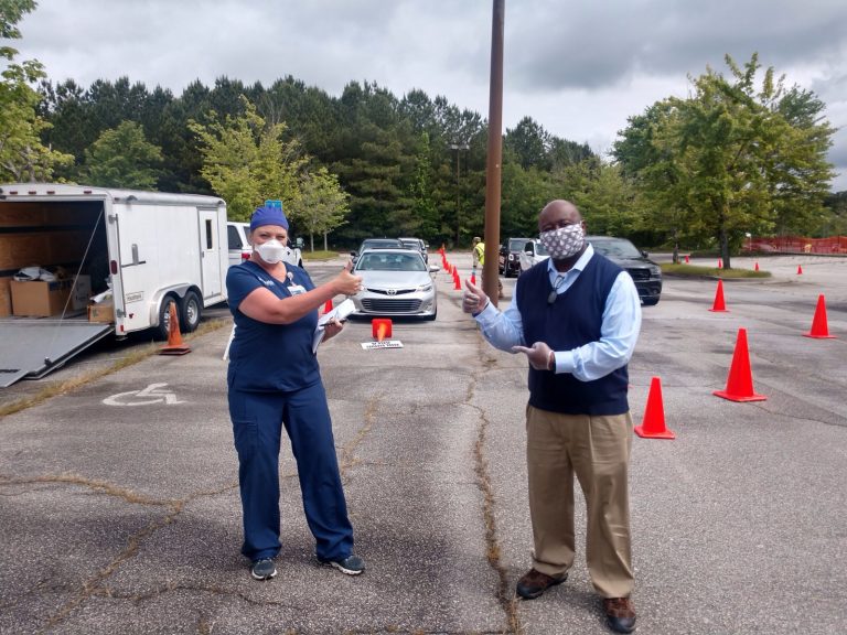 man and woman pointing to car line