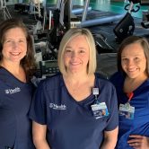 5 women in blue scrubs