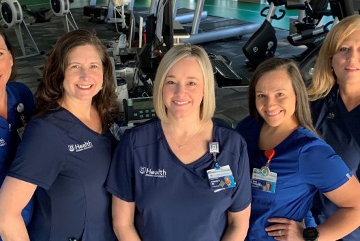 5 women in blue scrubs