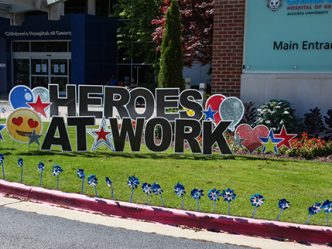Our AU Heroes sign