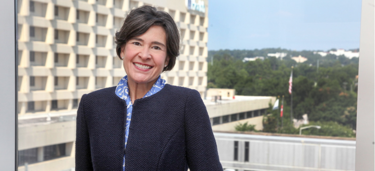 woman standing in front of window