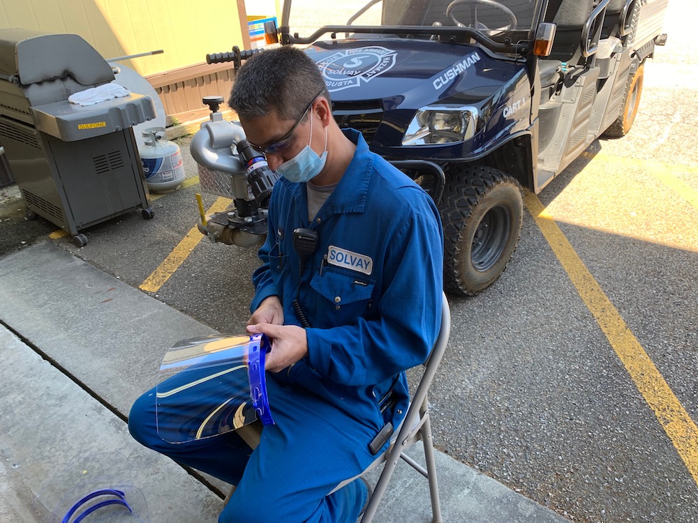 person making shield mask