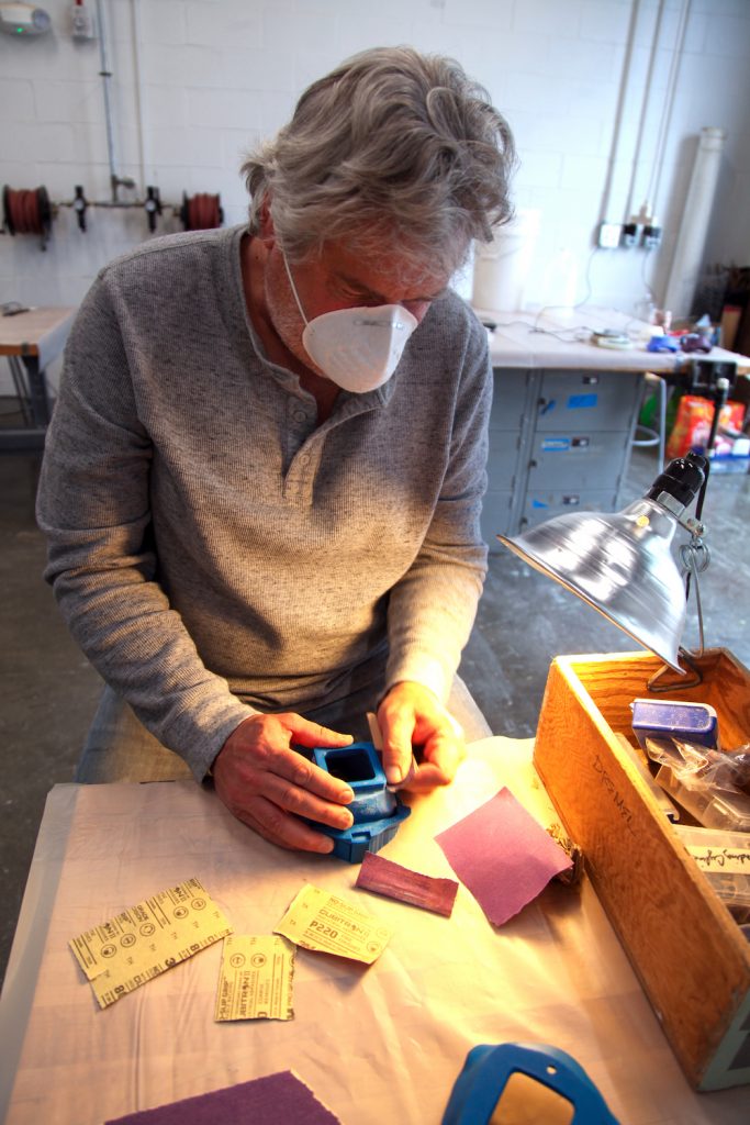 Man making molds.