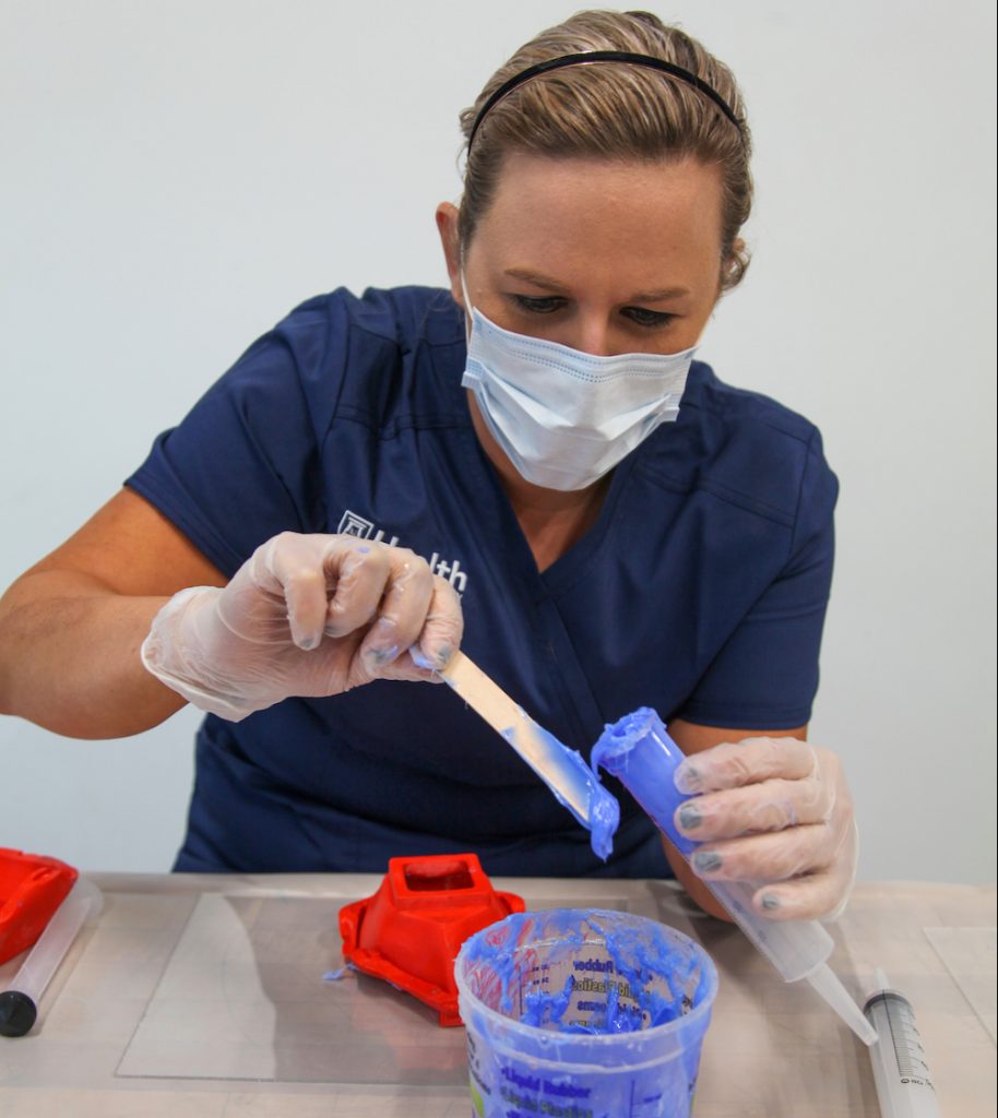 Woman making face masks.