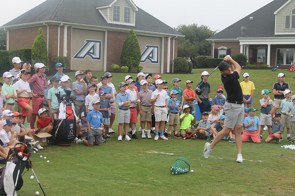 Kids watching golf