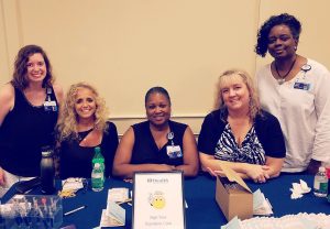 Five women pose for photo