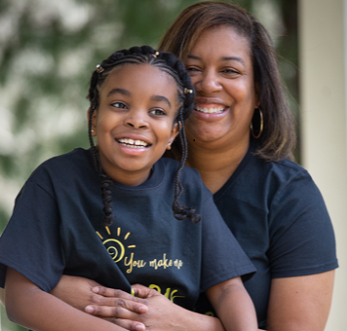 girl with mother in embrace