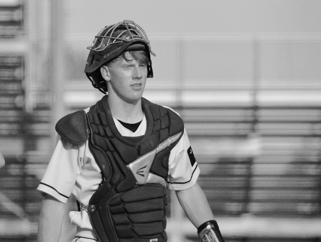 man in baseball uniform